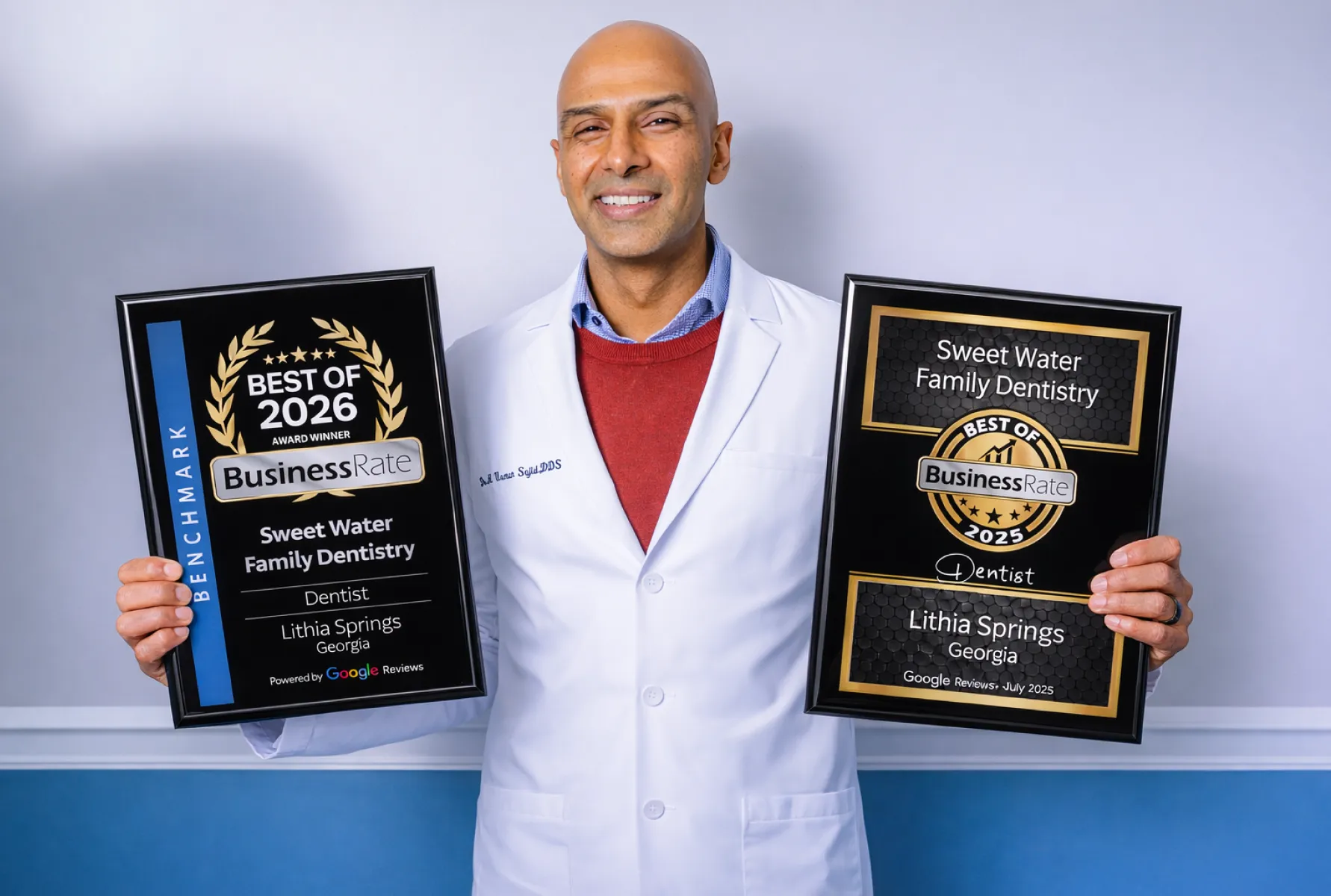 Dr. Sajid holding best of 2026 and 2025 certificates